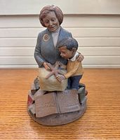 Full view of Tom Clark figurine teacher and child with starfish