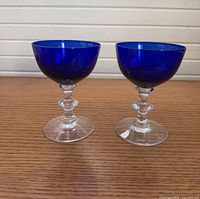 Two Ritz Blue Morgantown champagne coupes side by side