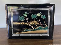Front view of album showing full Hawaiian scene and border