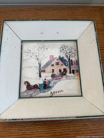 Framed tile with horse-drawn sleigh winter scene signed Moses