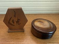 Both items front view showing agate lid and sculpture face