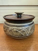 Front view of stoneware pot with lid on
