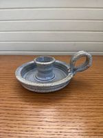 Side view showing entire stoneware candle holder with loop handle