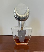 Front view showing bottle shape, cap design and fill level