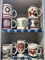 Cabinet view showing eight visible mugs across two shelves