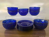 Full set showing all cobalt blue bowls and plates stacked