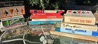Group shot of all board games and puzzles on table