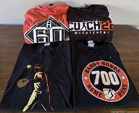 All four Giants graphic T-shirts laid out