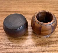 Both wooden containers with one lid removed to show interior