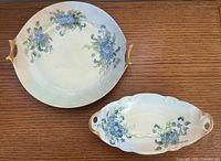Round platter and oval dish shown together for size and pattern reference