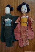 Front view of both cloth dolls displaying kimono colors and facial details