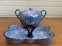 Front view of both lusterware pieces showing glaze and form