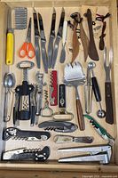 Drawer overview showing all utensils and corkscrews