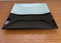 Top view showing the pale mint and black glass halves