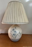Lamp with shade assembled