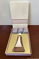 Box opened showing bottle and three soaps
