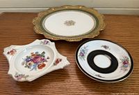 Three porcelain pieces showing overall condition and patterns
