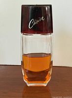 Front view of cologne bottle showing logo and liquid level