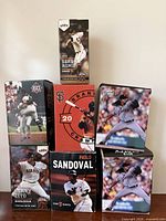 All seven bobblehead boxes stacked