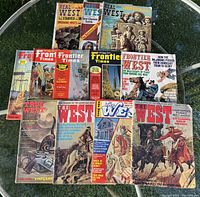 All 11 magazines spread out on glass table