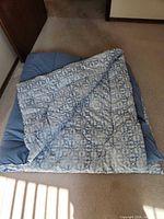Comforter laid flat showing patterned topside
