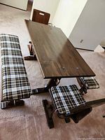 Overall view of table with one bench and one chair showing style and finish