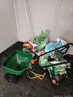 Broadcast spreader with group of fertilizer bags