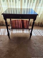 Full view of side table showing drawer, shelf and turned legs
