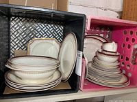 Overview of dinnerware in two crates