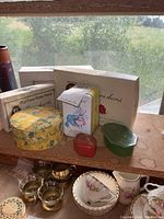 Group shot showing Laura Secord boxes, floral round box, metal tin, plastic trinket boxes