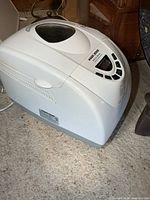 Full view of bread maker showing lid window and control panel