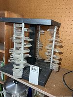 Full view of plastic carousel CD rack on shelf