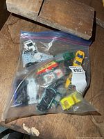 Zipper bag containing multiple die-cast cars