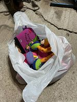 Bag showing colorful Groovy Girls dolls and accessories
