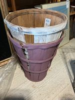 Burgundy basket side view showing slat construction and wear
