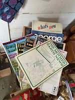 Pile showing Backwoods Home, George, What's New, The Mother Earth News