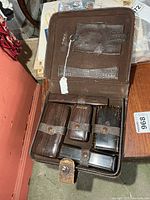 Open kit showing interior containers and accessories