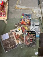 Group shot of five vintage magazines in sleeves