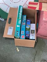 Box with Waddingtons 750 puzzle and two 500-piece puzzles inside carton