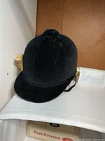 Front and side view of black velour riding hat