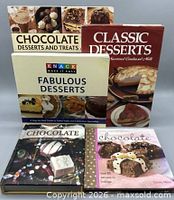 Front covers of all five cookbooks displayed upright