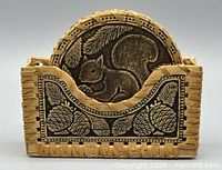 front view of birch bark coaster box with squirrel coaster inserted