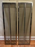 Front view of both IKEA Broder galvanized shelves upright