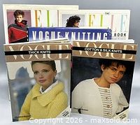 All five knitting books standing, front covers visible