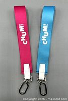 Front view of both wrist loop keychains showing colors, logos and hardware