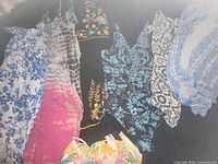 Group shot of all six dresses displaying patterns and colors