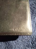 Embossed Calvin Klein logo on wallet corner