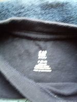 Brand neck tag showing Gap Kids size small 6-7