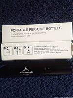 Atomizer and retail box front view showing product details