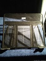 Front view of black mesh laptop stand
